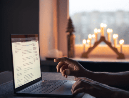 man-reads-news-while-sitting-front-laptop-screen-night 1