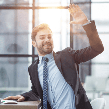 hello by man office indoor waving hand 1